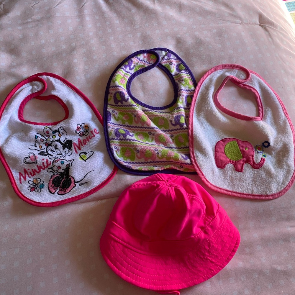 Baby hat and three infant girls bibs lot